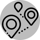 A gray circular icon with location markers connected by a dotted path, symbolizing navigation or route planning.